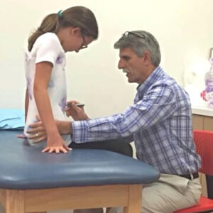 Girl Getting a Brace Check by Orthotist